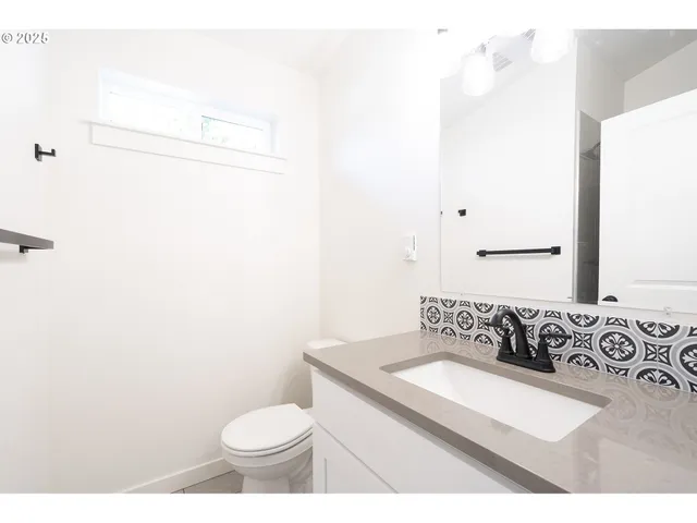 a bathroom with a toilet and a sink