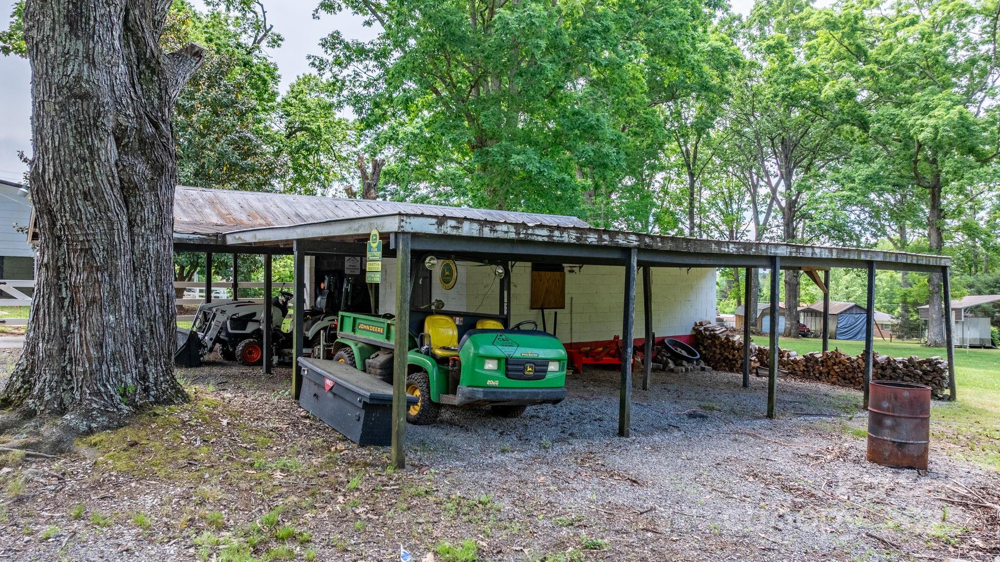 1826 Walt Arney Road Lenoir, NC 28645 - Photo 11 of 40 a backyard of a house with yard barbeque oven table and chairs