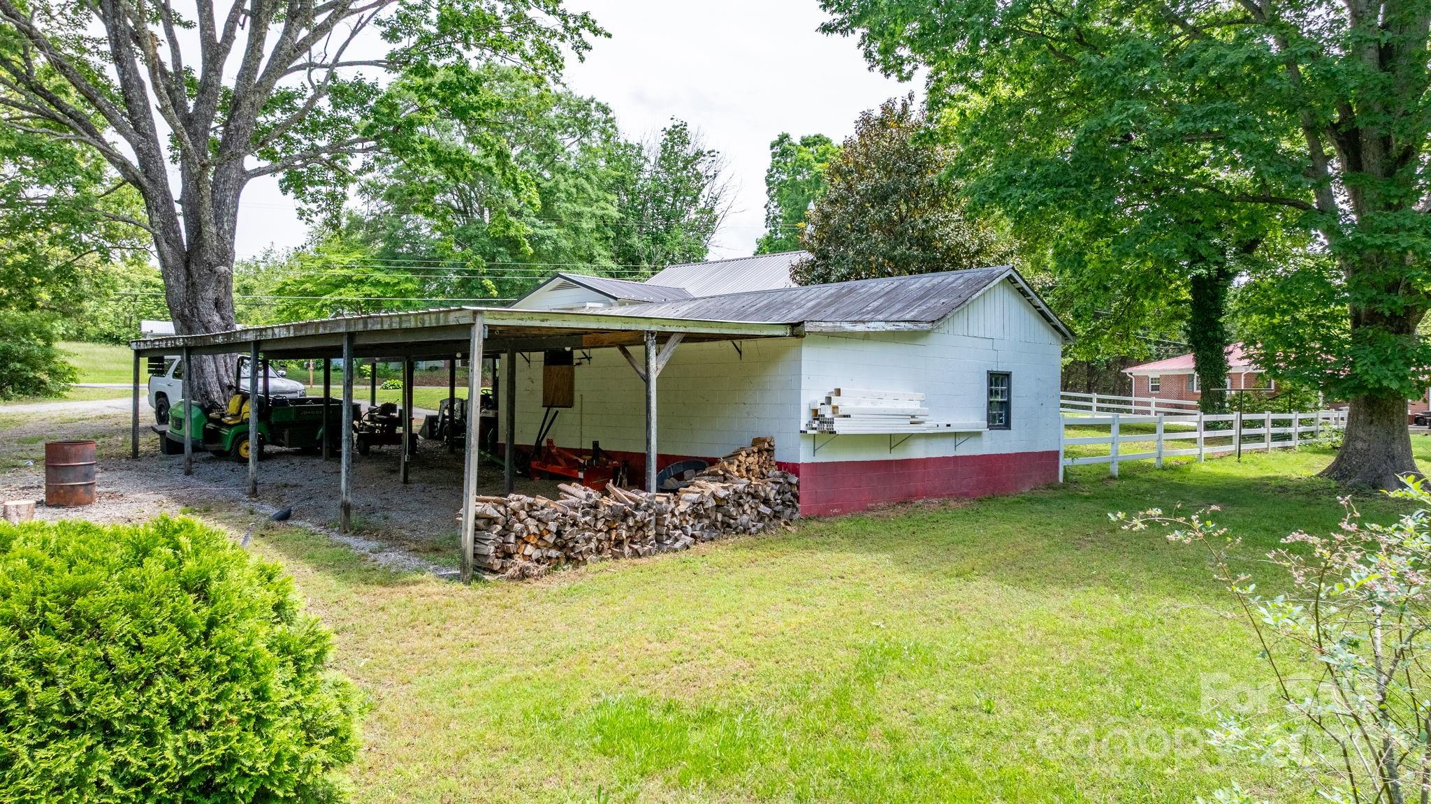 1826 Walt Arney Road Lenoir, NC 28645 - Photo 12 of 40 a view of house with backyard and outdoor seating