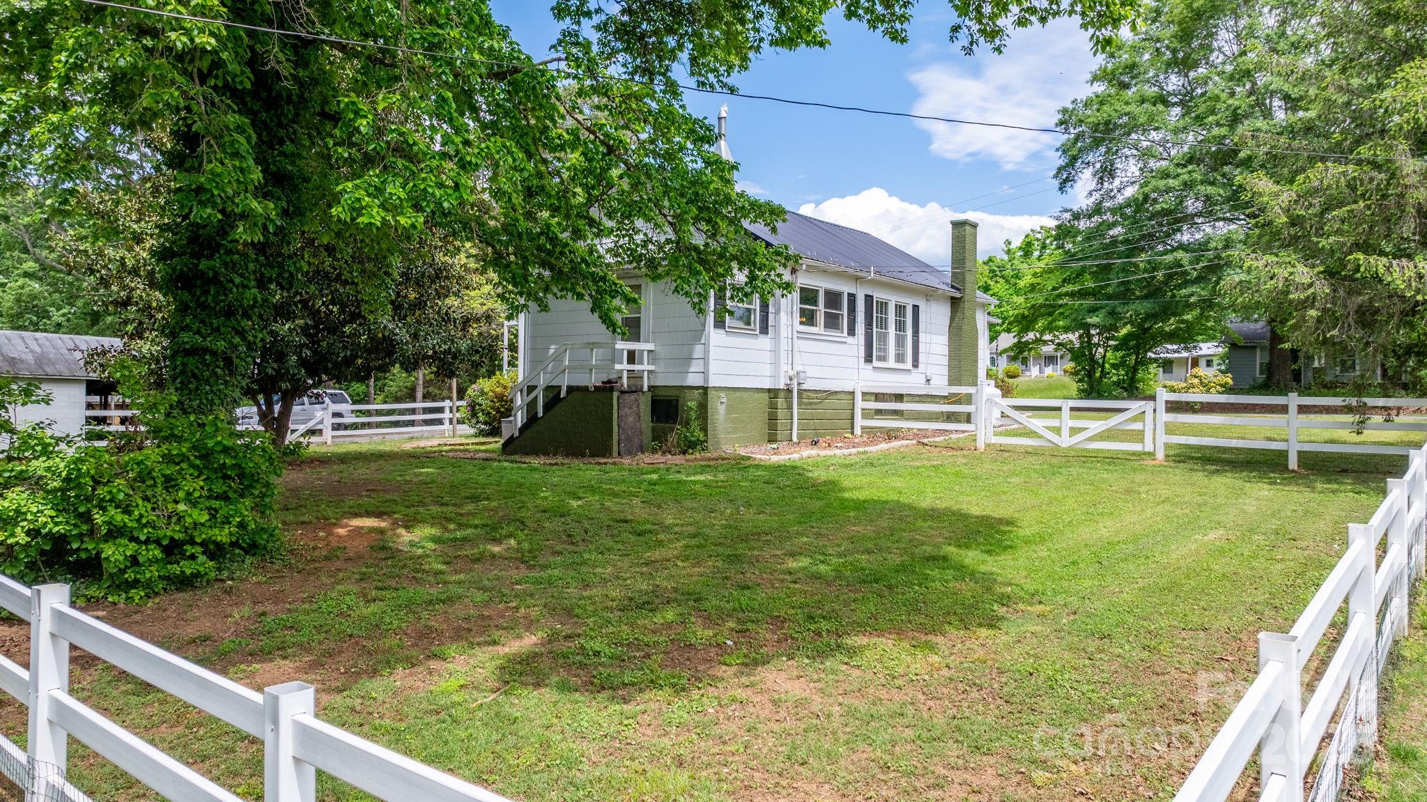 1826 Walt Arney Road Lenoir, NC 28645 - Photo 14 of 40 a view of house with a yard