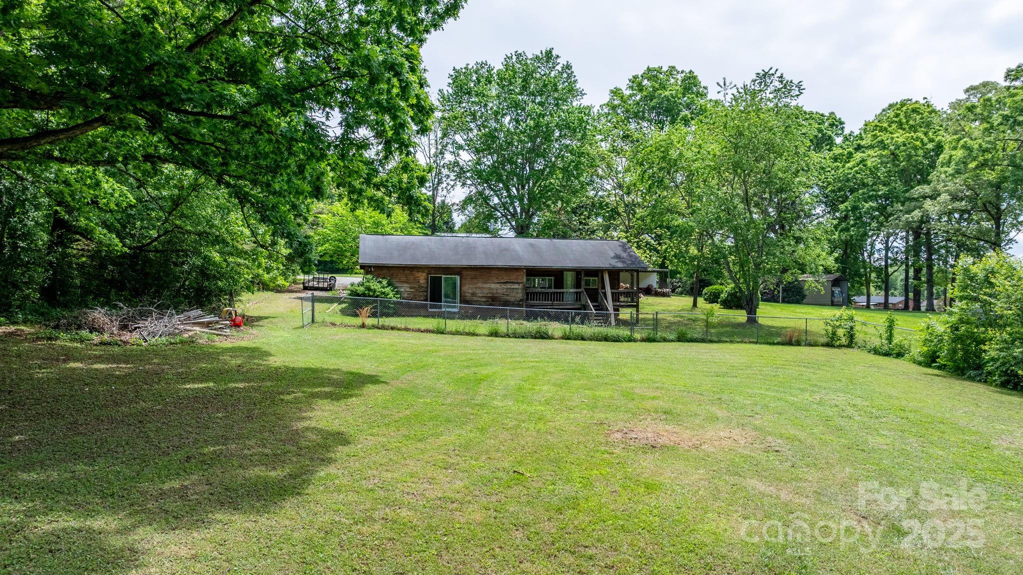 1826 Walt Arney Road Lenoir, NC 28645 - Photo 17 of 40 a view of a house with a backyard
