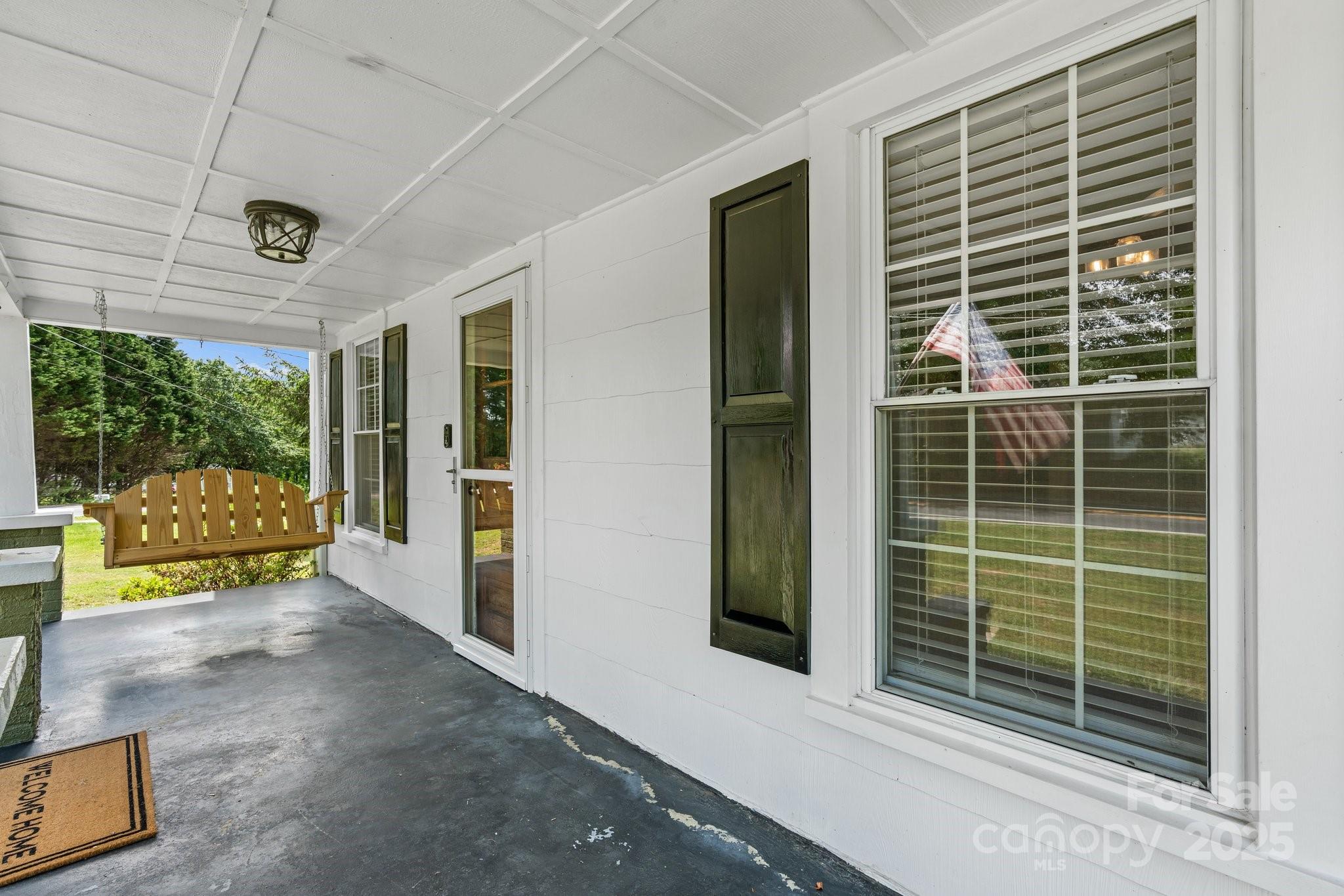 1826 Walt Arney Road Lenoir, NC 28645 - Photo 24 of 40 a view of porch with a door and balcony