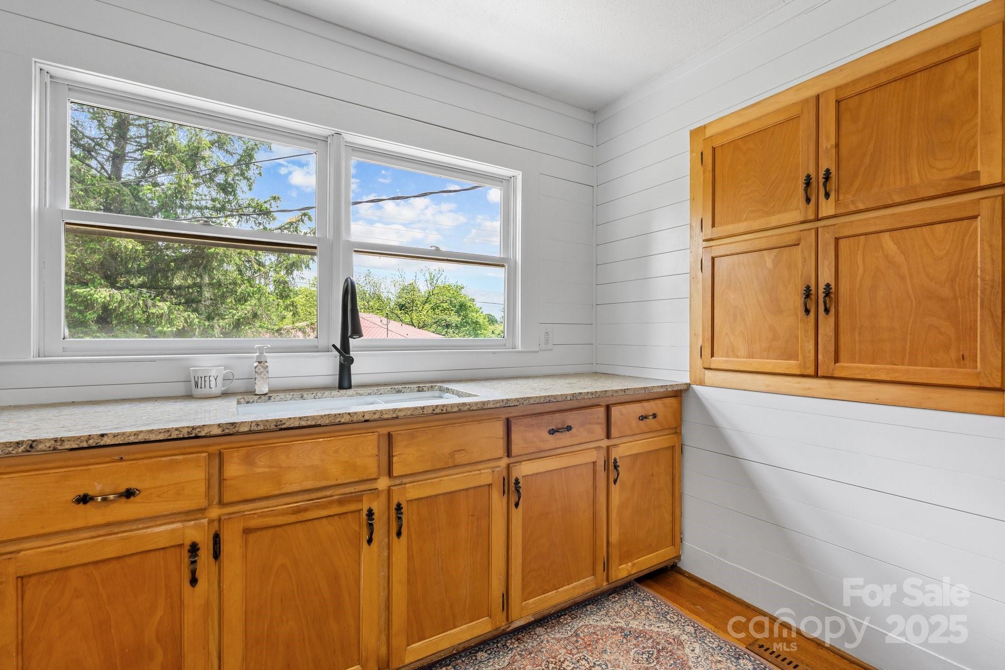 1826 Walt Arney Road Lenoir, NC 28645 - Photo 28 of 40 a bathroom with a sink and a window