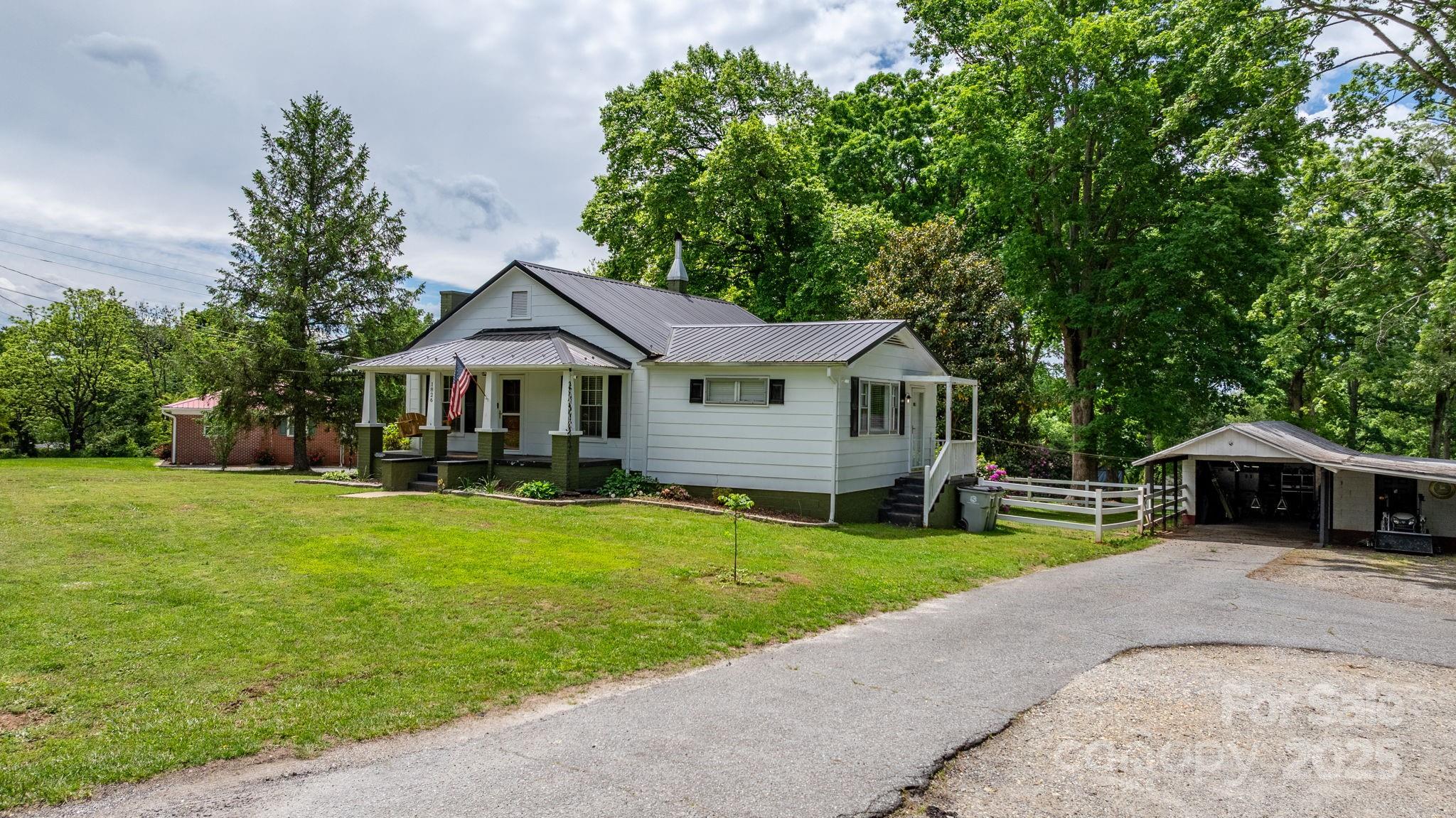 1826 Walt Arney Road Lenoir, NC 28645 - Photo 3 of 40 a front view of a house with garden