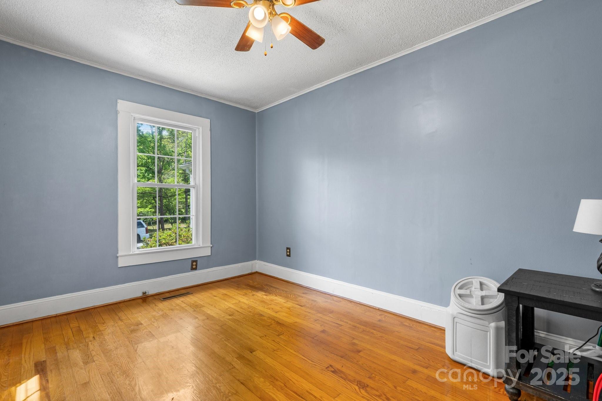 1826 Walt Arney Road Lenoir, NC 28645 - Photo 36 of 40 a view of a room with a window and wooden floor