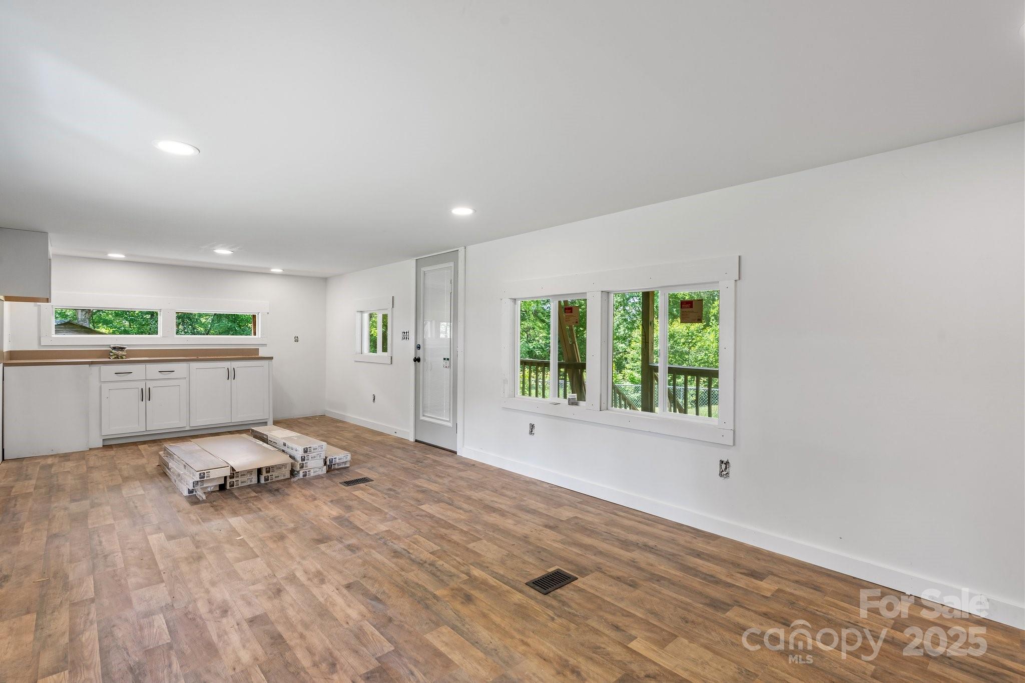 1826 Walt Arney Road Lenoir, NC 28645 - Photo 39 of 40 a view of a livingroom with wooden floor and window