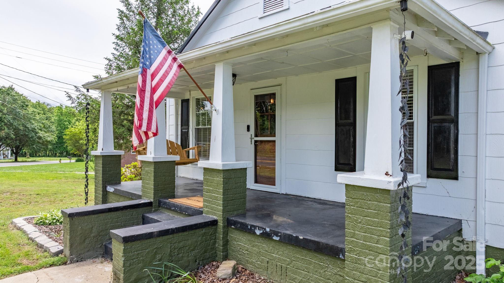 1826 Walt Arney Road Lenoir, NC 28645 - Photo 6 of 40 a front view of a house with garden