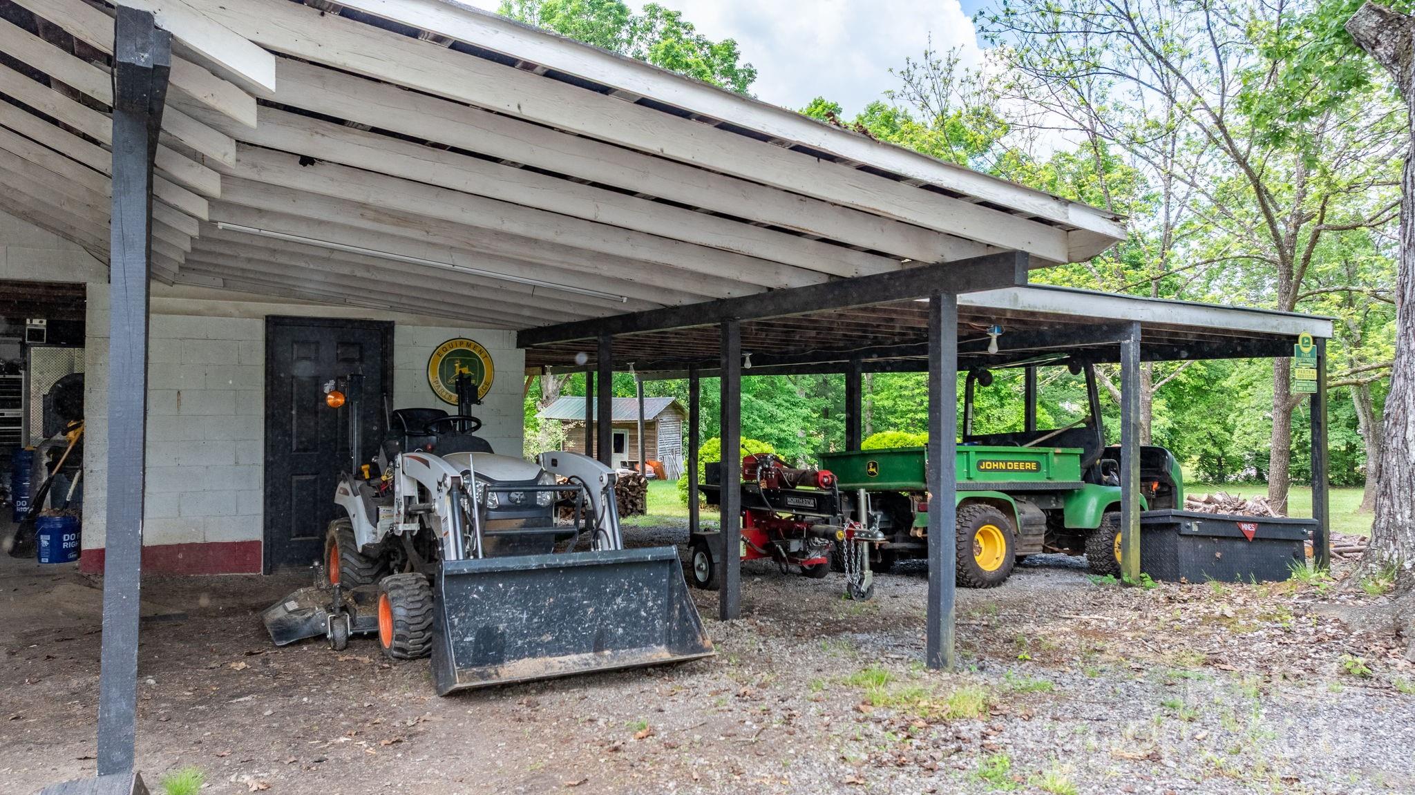 1826 Walt Arney Road Lenoir, NC 28645 - Photo 9 of 40 a view of a patio with a table chairs and a backyard