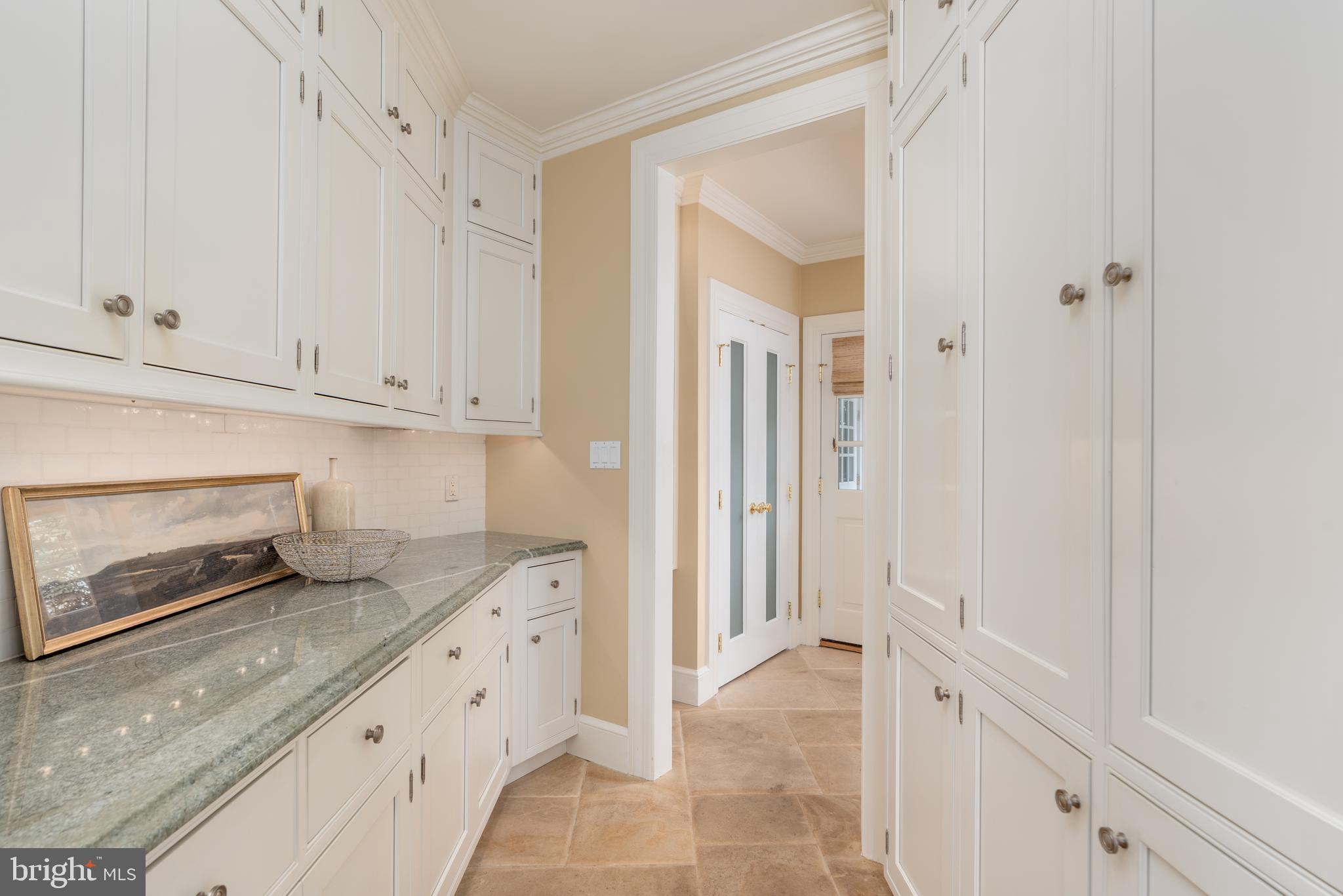 2911 45th Street Northwest Washington, DC 20016 - Photo 14 of 49 a kitchen with white cabinets and sink