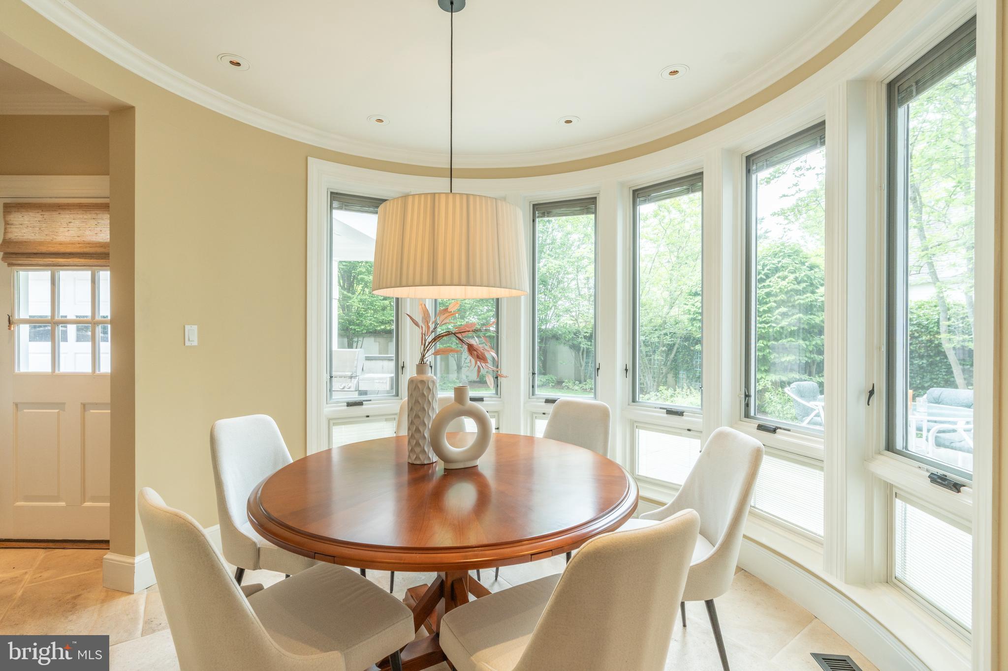 2911 45th Street Northwest Washington, DC 20016 - Photo 15 of 49 a dining room with furniture a chandelier and wooden floor