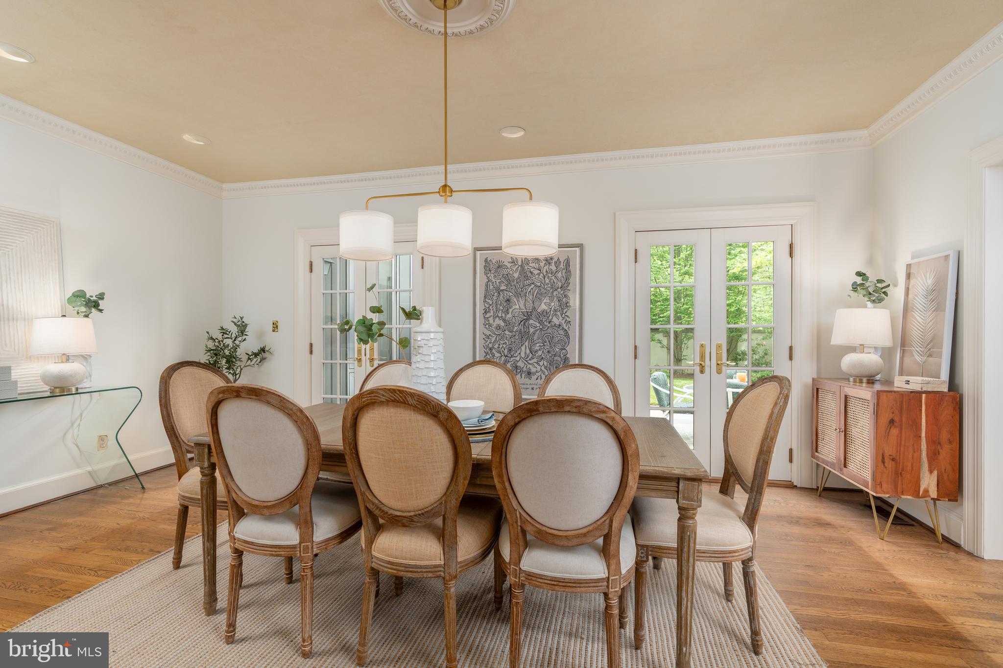 2911 45th Street Northwest Washington, DC 20016 - Photo 18 of 49 a dining room with furniture a chandelier and wooden floor