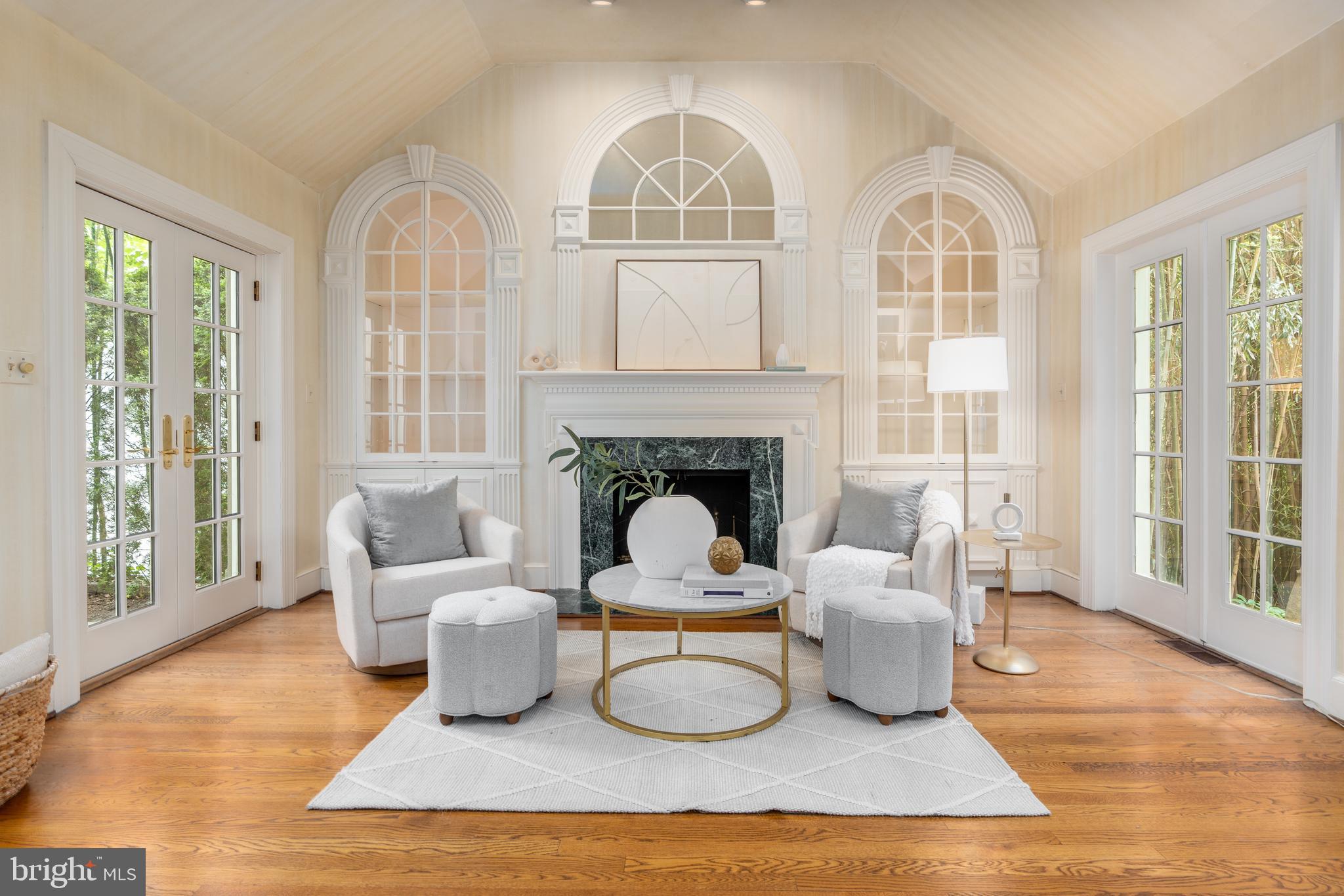 2911 45th Street Northwest Washington, DC 20016 - Photo 20 of 49 a living room with furniture a window and a fireplace