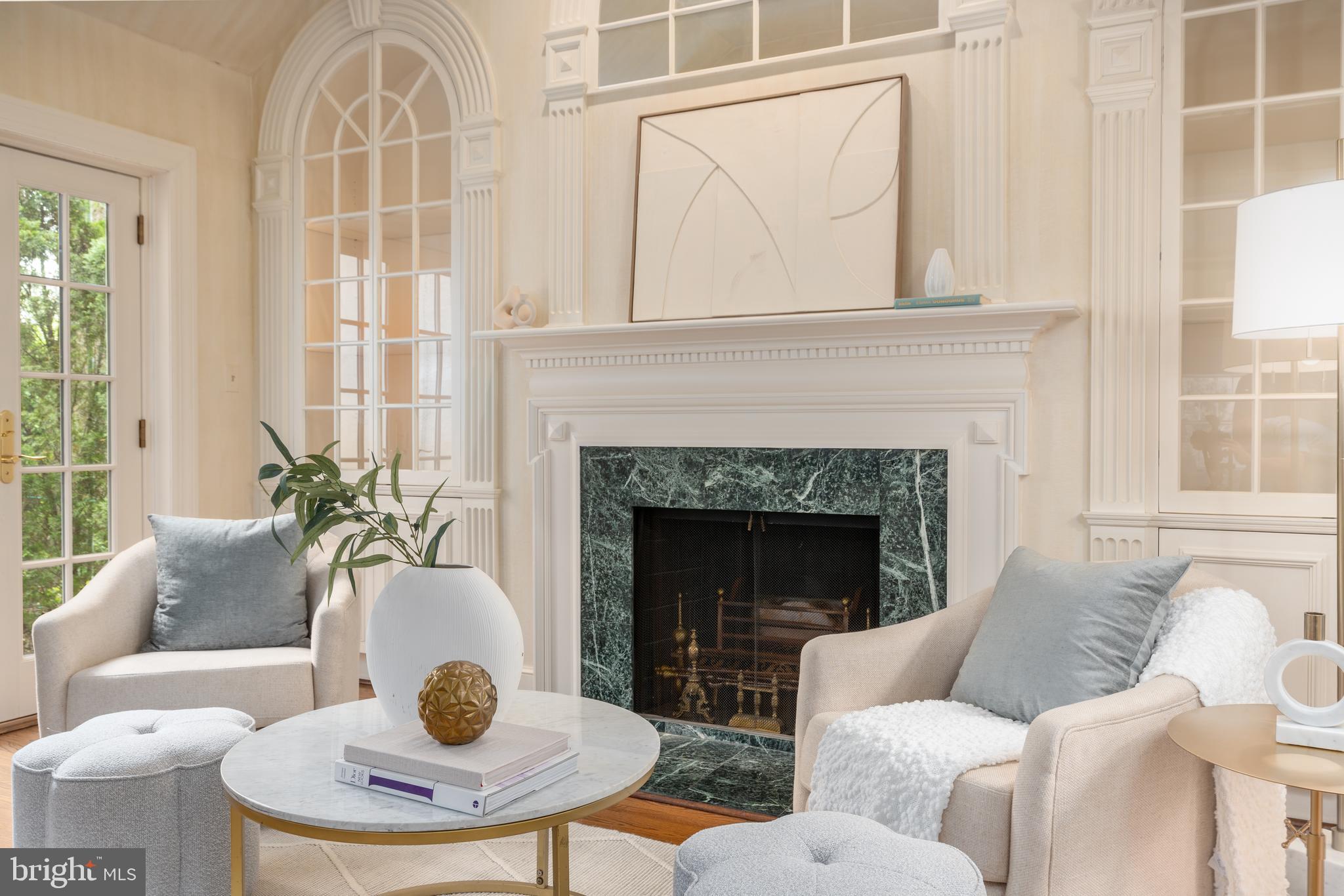 2911 45th Street Northwest Washington, DC 20016 - Photo 21 of 49 a living room with furniture a fireplace and a large window