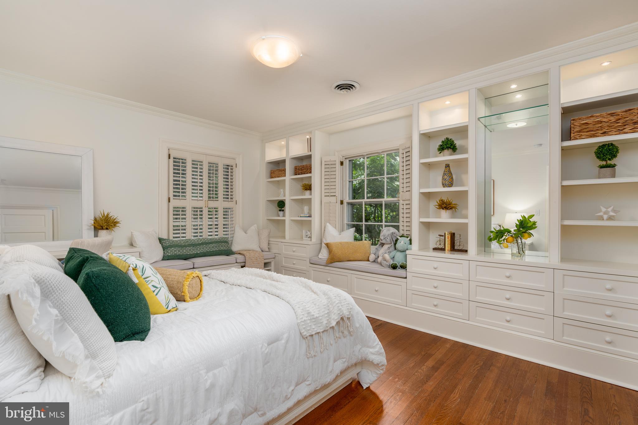 2911 45th Street Northwest Washington, DC 20016 - Photo 27 of 49 a spacious bedroom with a bed and wooden floor