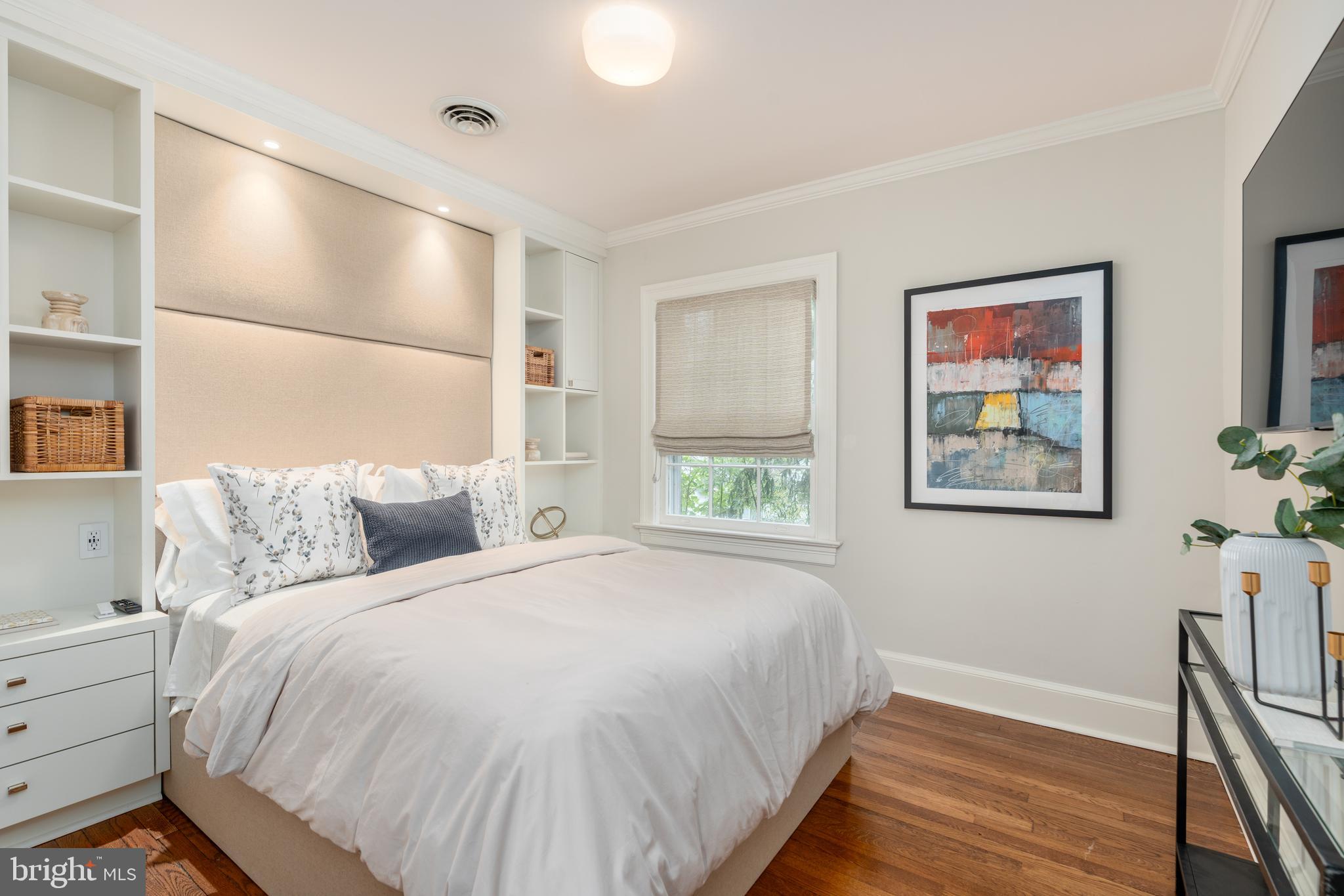 2911 45th Street Northwest Washington, DC 20016 - Photo 28 of 49 a large bed sitting in a bedroom next to a window