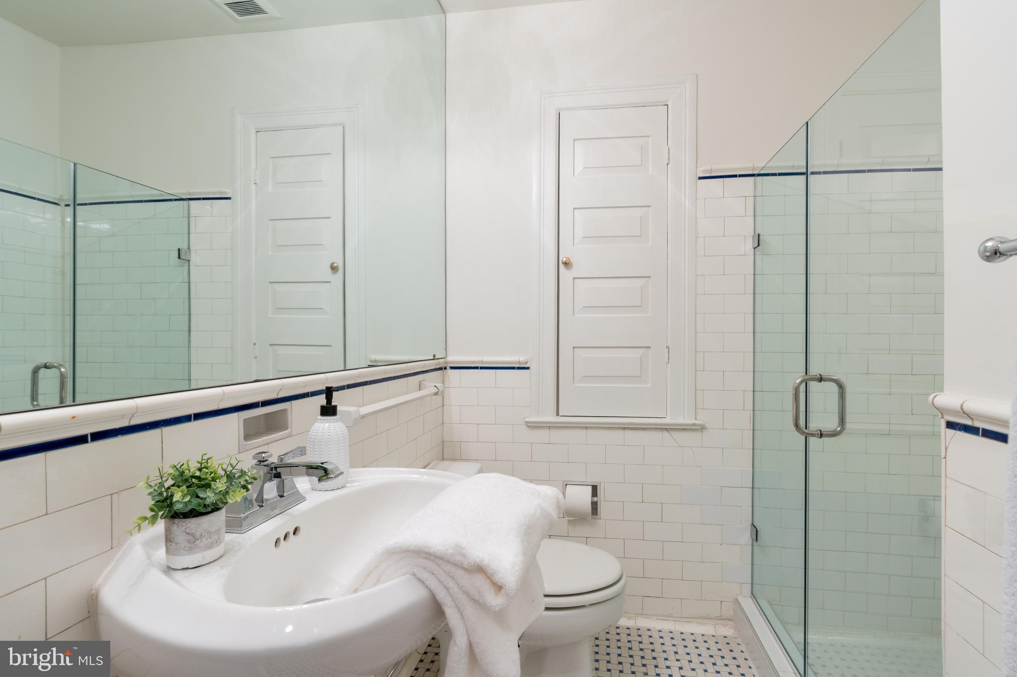 2911 45th Street Northwest Washington, DC 20016 - Photo 29 of 49 a bathroom with a sink toilet and shower