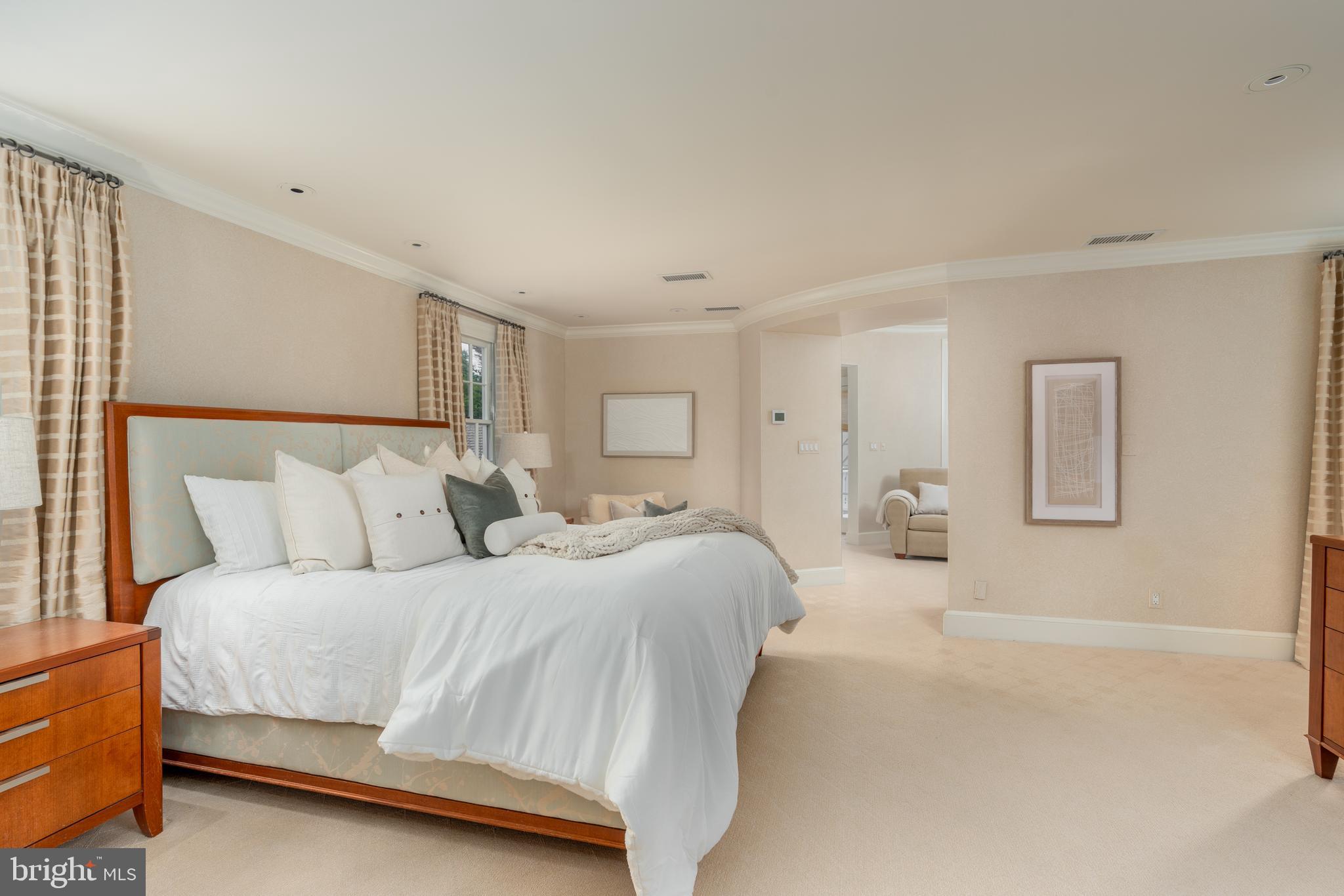 2911 45th Street Northwest Washington, DC 20016 - Photo 30 of 49 a spacious bedroom with a bed and a couch