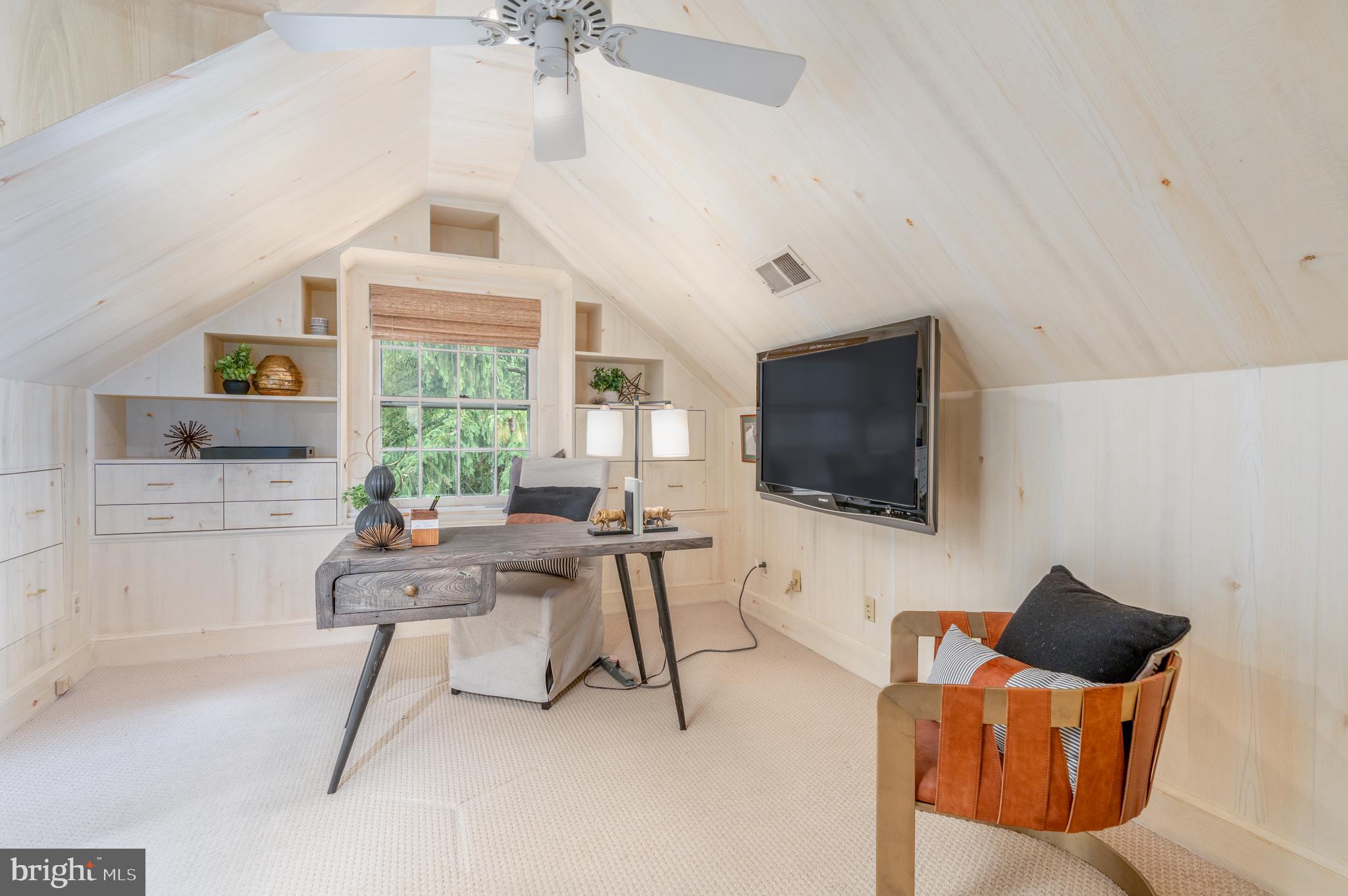 2911 45th Street Northwest Washington, DC 20016 - Photo 40 of 49 a living room with furniture and a flat screen tv