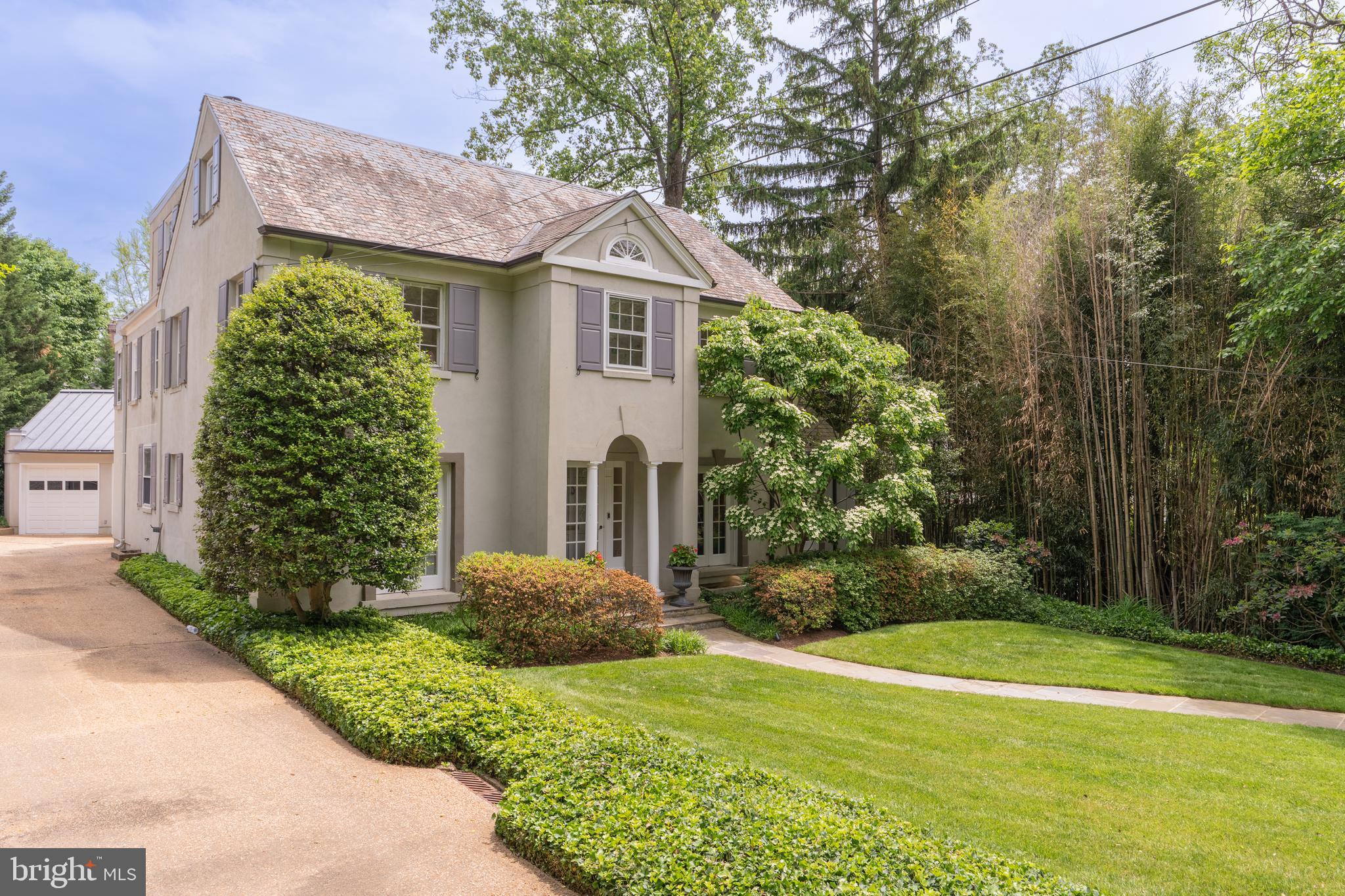 2911 45th Street Northwest Washington, DC 20016 - Photo 4 of 49 a front view of a house with garden
