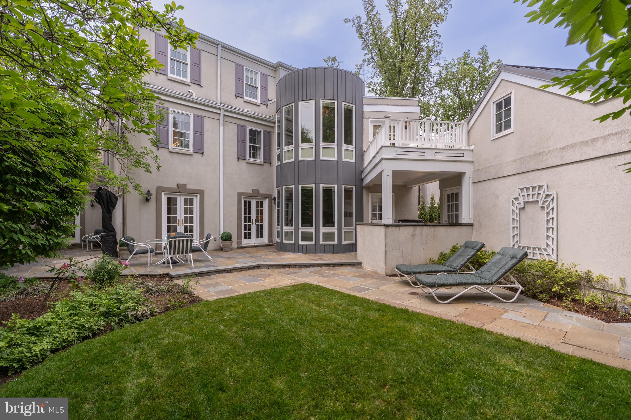 2911 45th Street Northwest Washington, DC 20016 - Photo 44 of 49 a view of backyard of house with outdoor seating and covered with trees