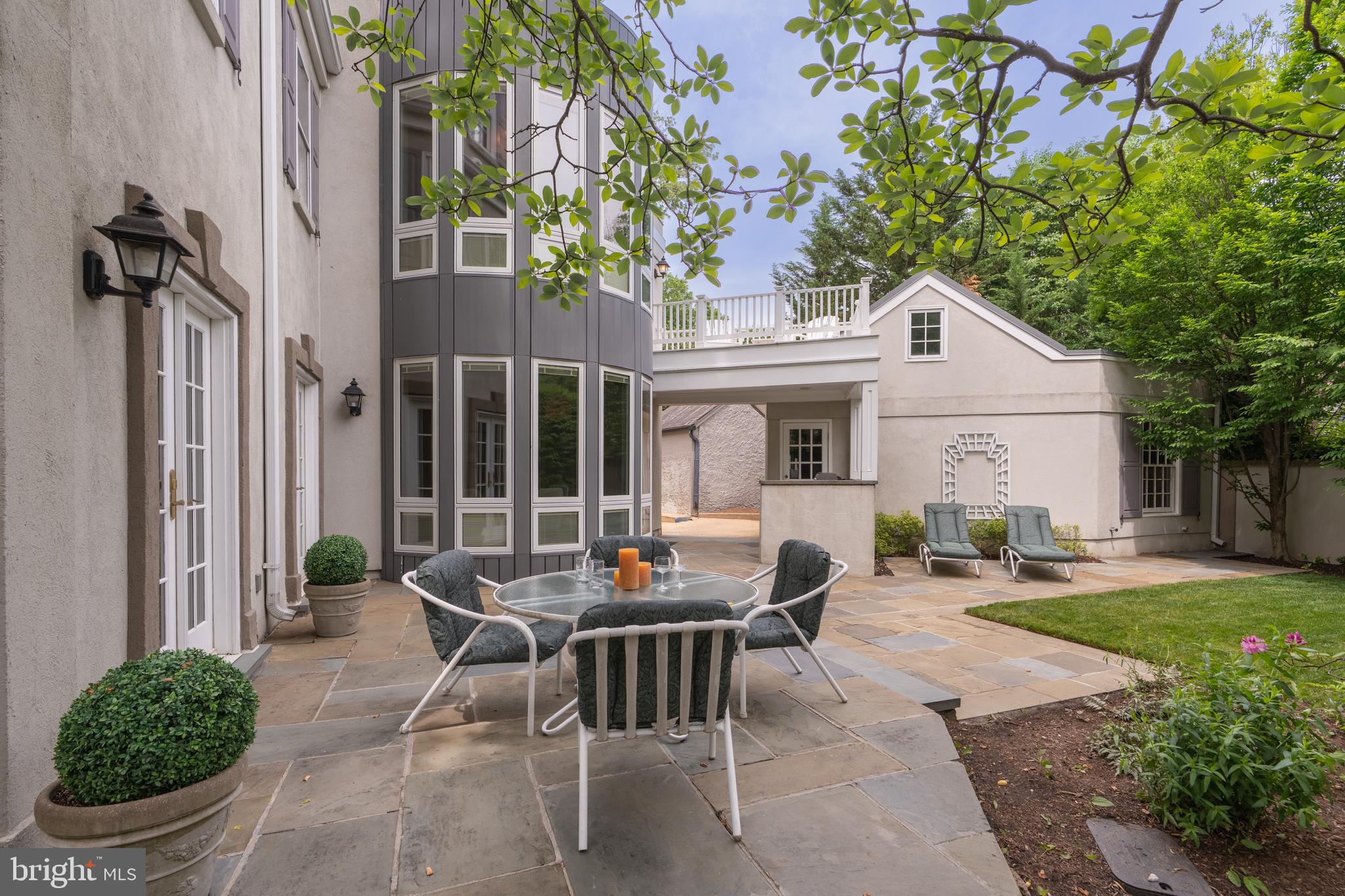 2911 45th Street Northwest Washington, DC 20016 - Photo 47 of 49 a backyard of a house with table and chairs