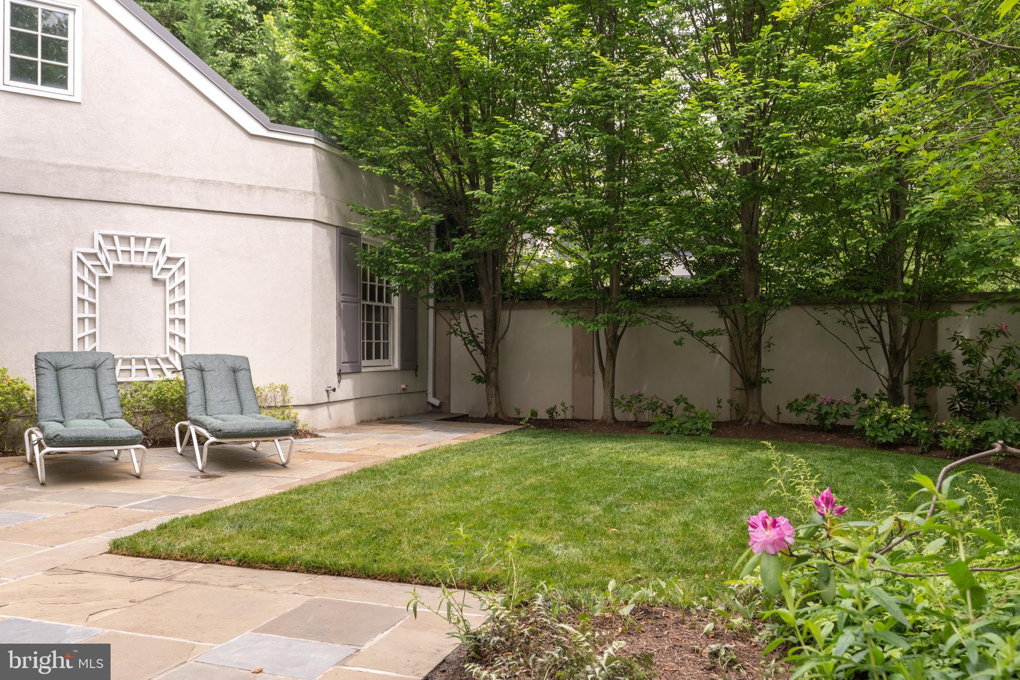 2911 45th Street Northwest Washington, DC 20016 - Photo 48 of 49 a backyard of a house with table and chairs
