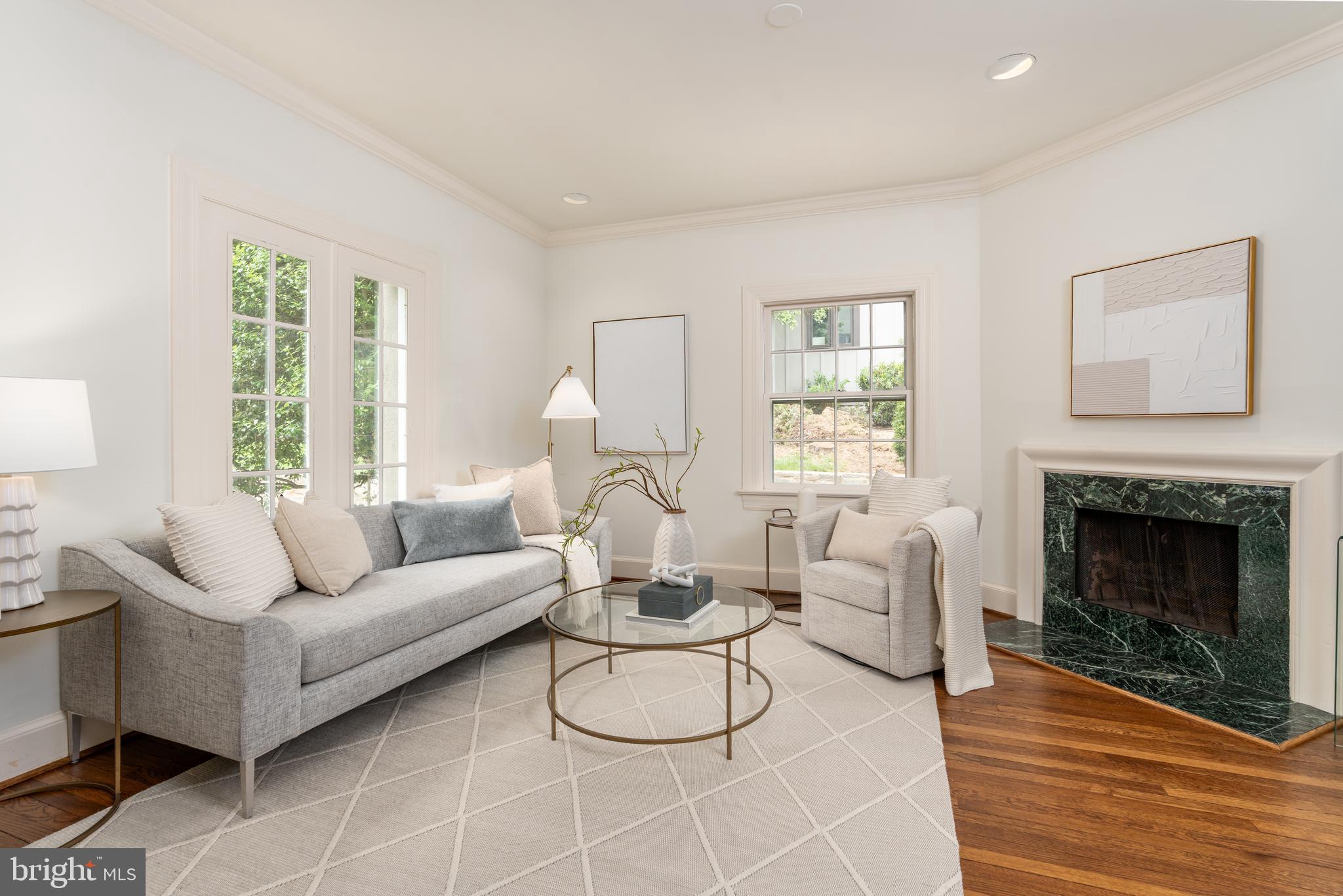 2911 45th Street Northwest Washington, DC 20016 - Photo 6 of 49 a living room with furniture a fireplace and a large window