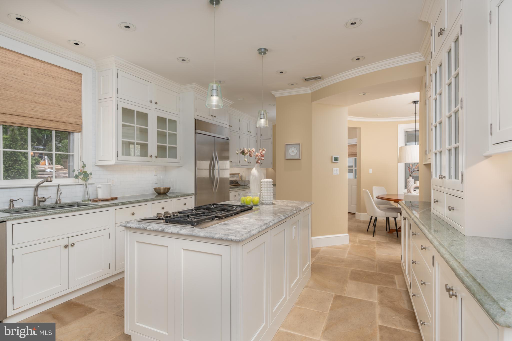 2911 45th Street Northwest Washington, DC 20016 - Photo 10 of 49 a kitchen with granite countertop a sink stove and cabinets