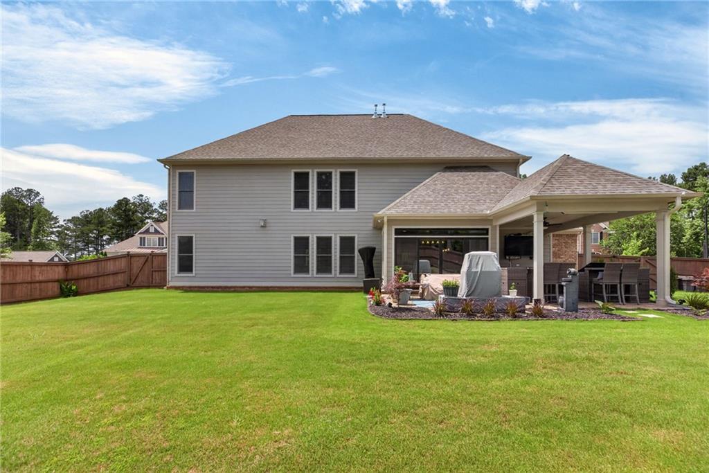 139 Manchester Lane Villa Rica, GA 30180 - Photo 45 of 60 a front view of a house with a garden and yard