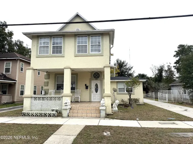 a front view of a house with a view of a house