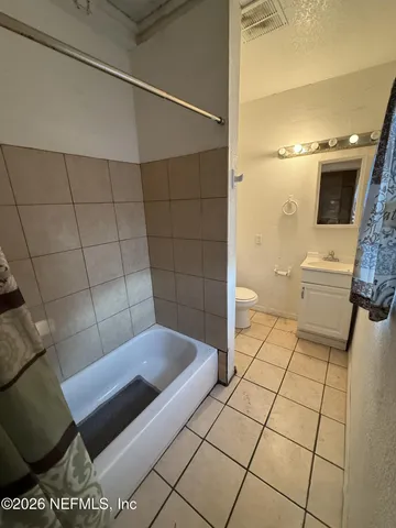 a bathroom with a shower and a toilet