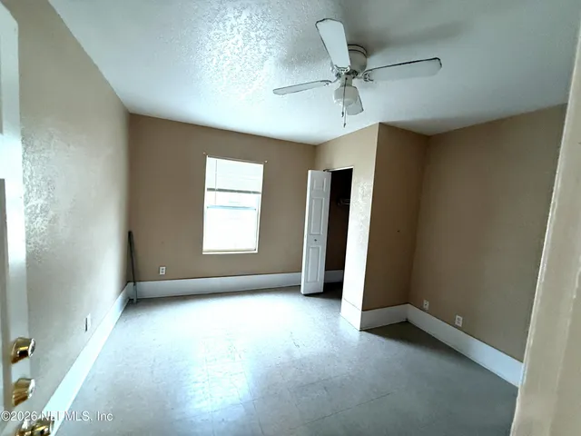wooden floor and window in an empty room