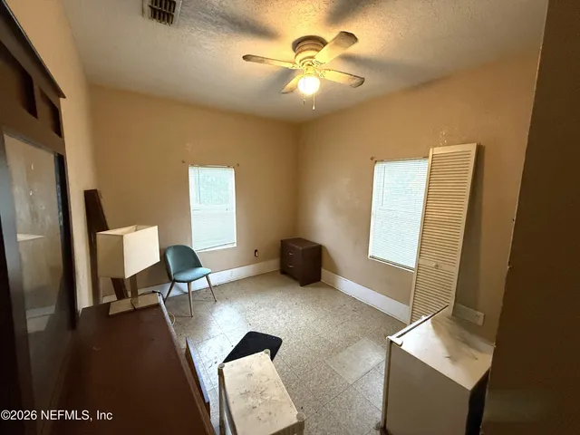 a workspace with furniture and a window