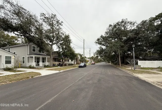 a view of a street with a house