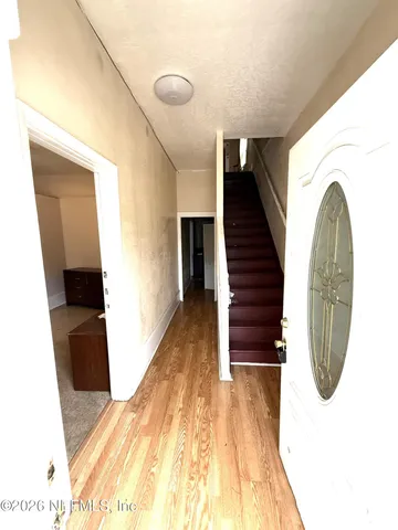 a view of entryway with wooden floor