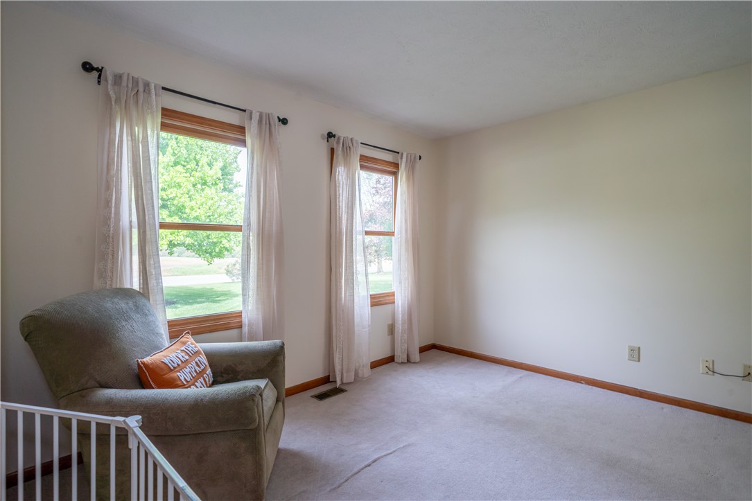 3628 Petre Road Springfield, OH 45502 - Photo 11 of 52 Bright and airy room with large windows, offering a versatile space for living or relaxation.