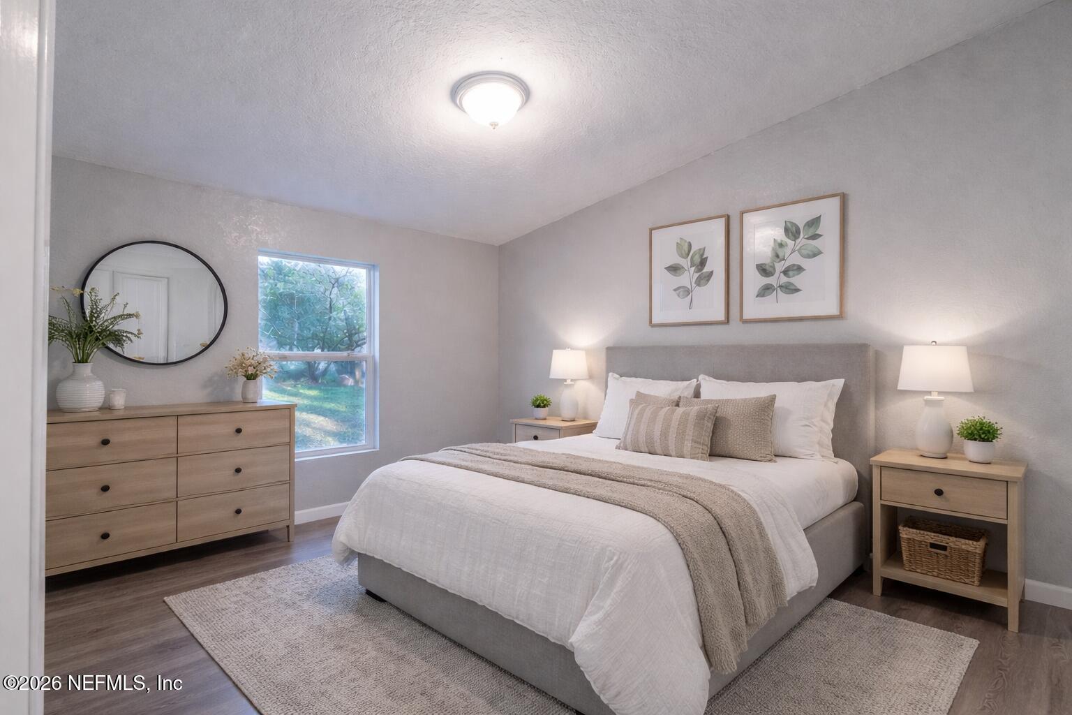 3245 Byo Road Jacksonville, FL 32207 - Photo 11 of 25 a bedroom with a bed and a dresser