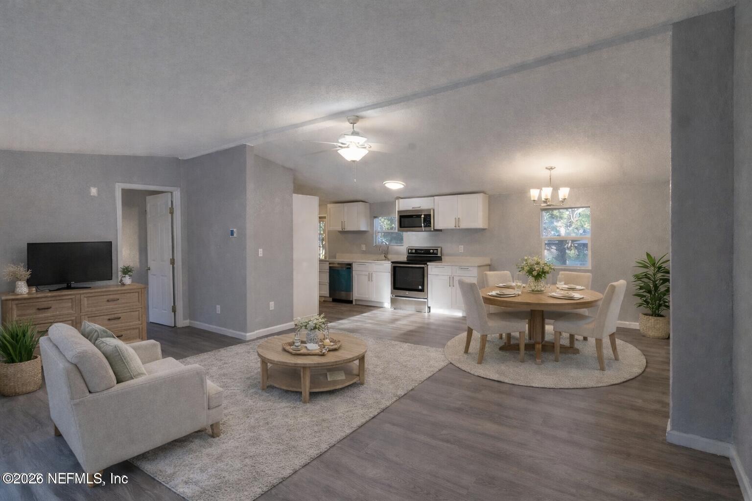 3245 Byo Road Jacksonville, FL 32207 - Photo 5 of 25 a view of a dining room with furniture and wooden floor