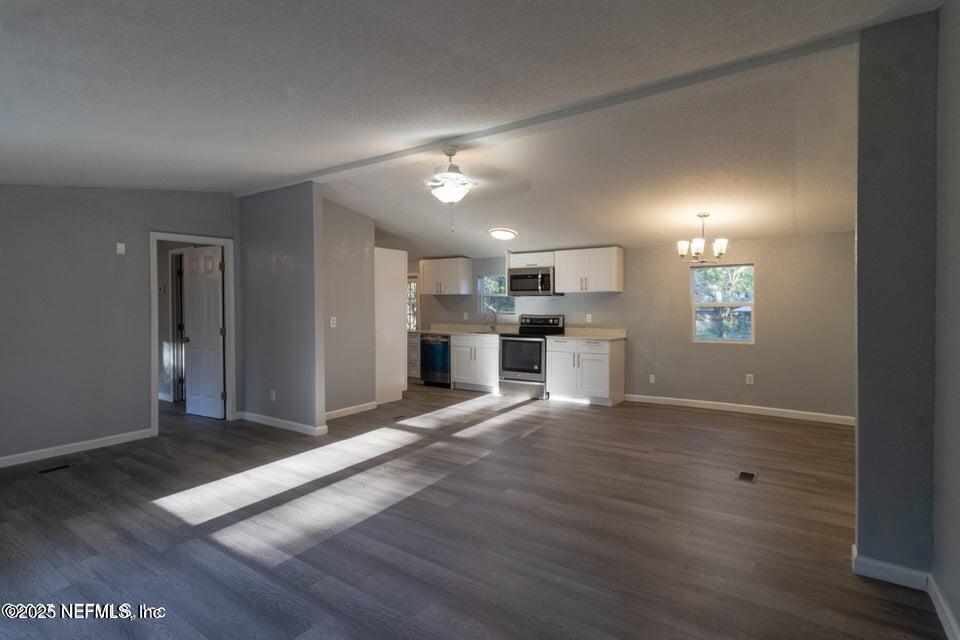 3245 Byo Road Jacksonville, FL 32207 - Photo 6 of 25 a view of a kitchen with a sink and a refrigerator