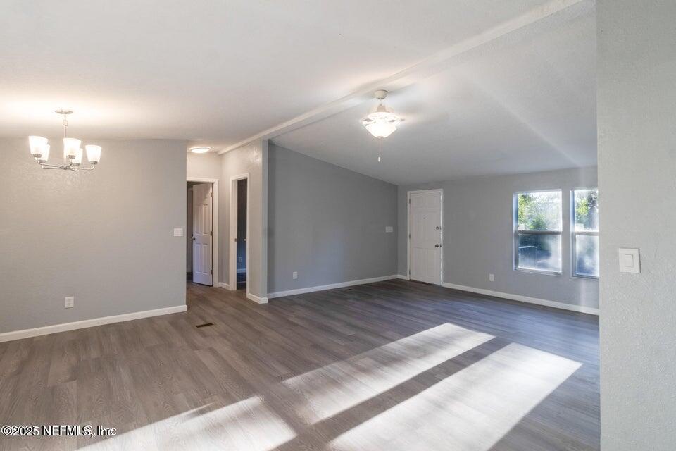 3245 Byo Road Jacksonville, FL 32207 - Photo 8 of 25 an empty room with wooden floor and windows