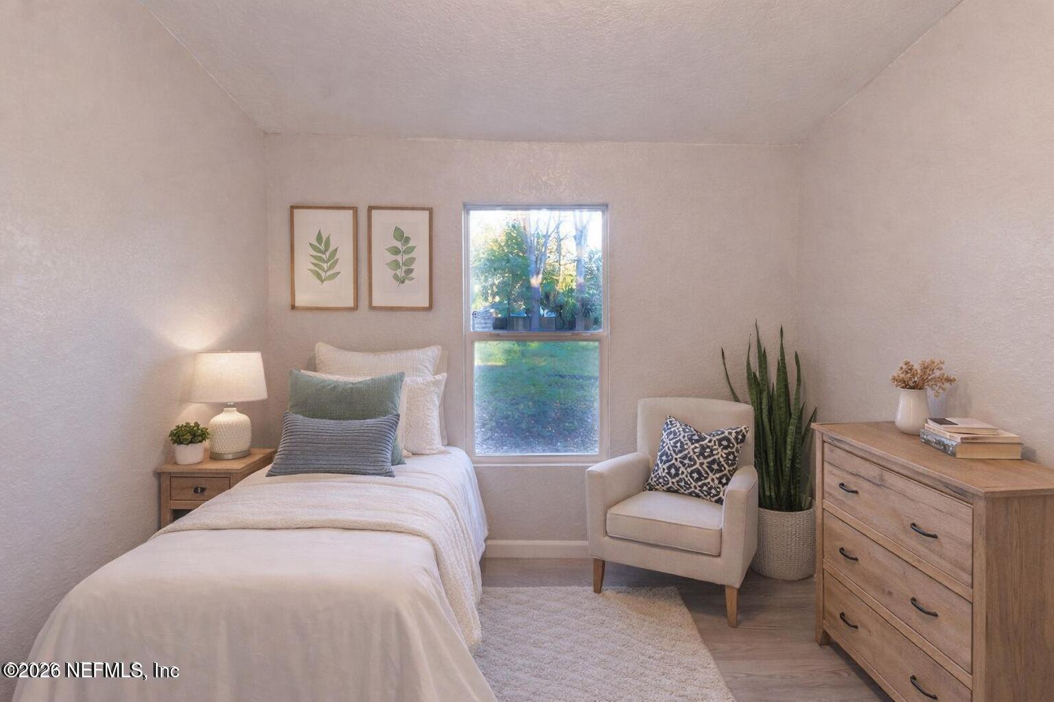 3245 Byo Road Jacksonville, FL 32207 - Photo 9 of 25 a bedroom with a bed and a window
