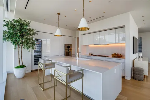 a very nice looking dining room with a large window