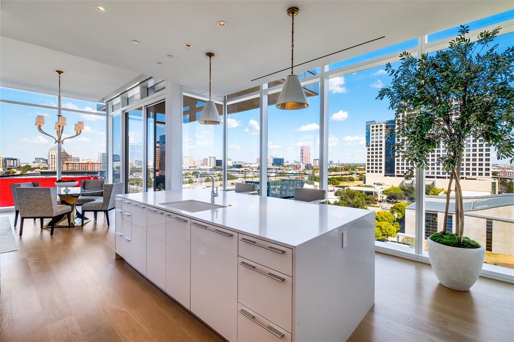 1747 Leonard Street, Unit 802 Dallas, TX 75201 - Photo 9 of 26 a very nice looking dining room with a large window