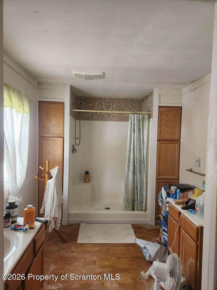 374 Country Road Falls, PA 18615 - Photo 11 of 21 a view of a room with gym equipment and a window