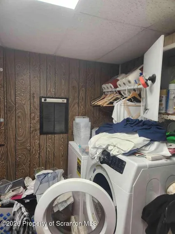 a bed room with a bed and a tv