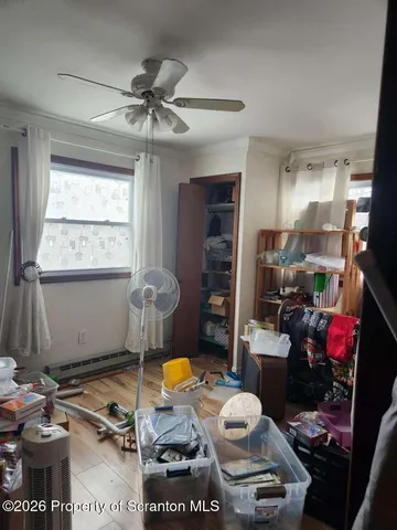 a room with furniture a window and gym equipment