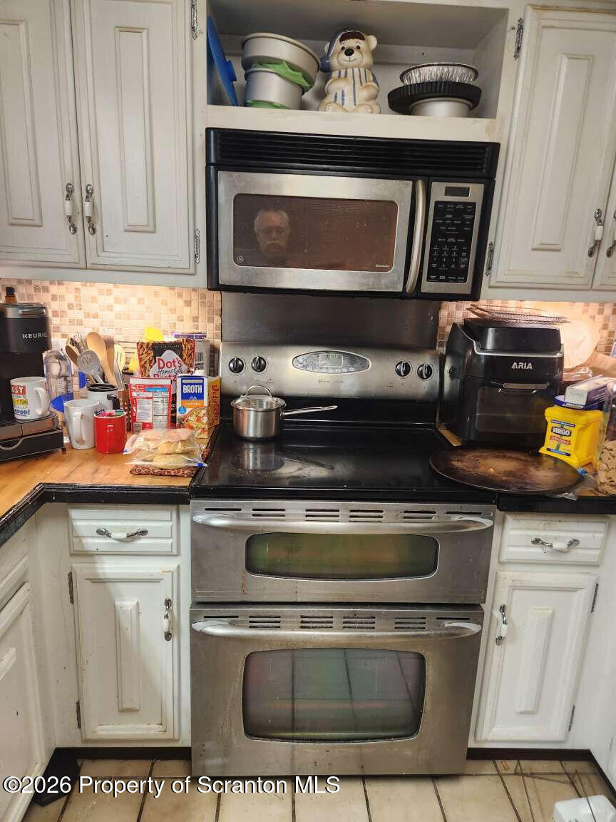 374 Country Road Falls, PA 18615 - Photo 14 of 21 a stove top oven sitting inside of a kitchen