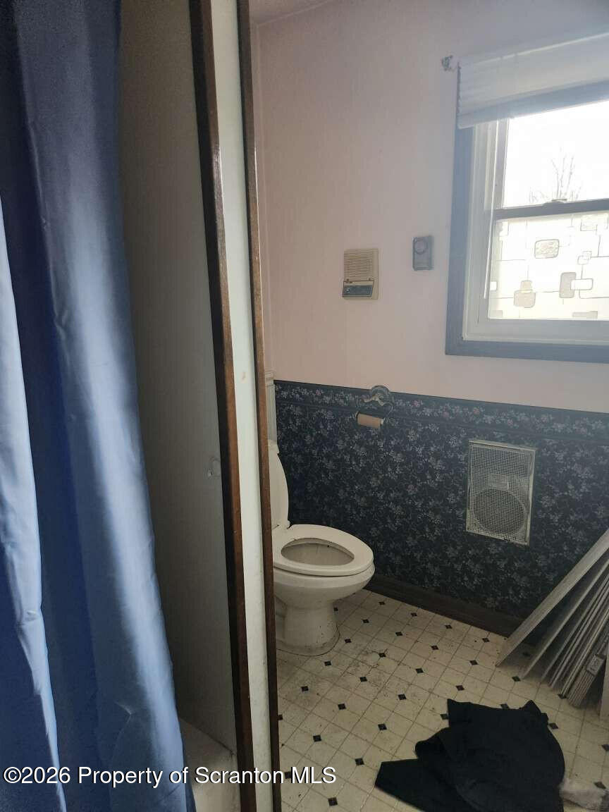 374 Country Road Falls, PA 18615 - Photo 16 of 21 a bathroom with a toilet and a shower