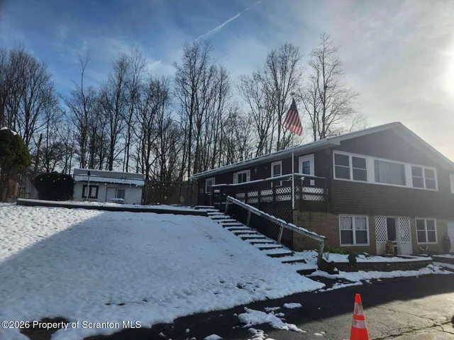 a balcony with trees in front of it