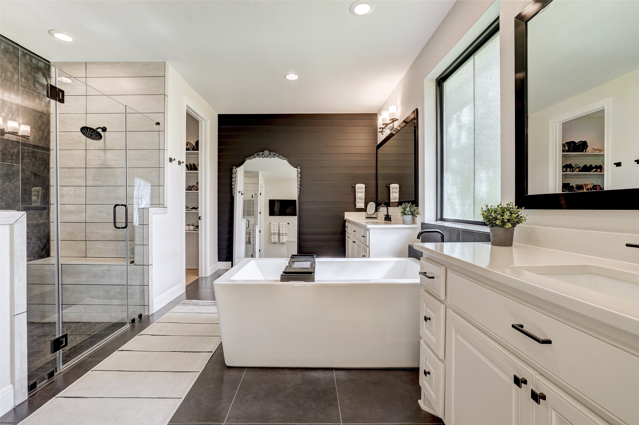 400 Flint Ridge Trail Georgetown, TX 78628 - Photo 17 of 40 Primary bathroom with a walk in closet, two vanities, shower, a freestanding bath, and tile flooring
